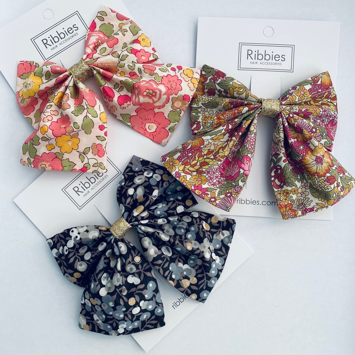 liberty bows hand made in london on  a french barrette. Hand sewn and solidly glued to the french barrette