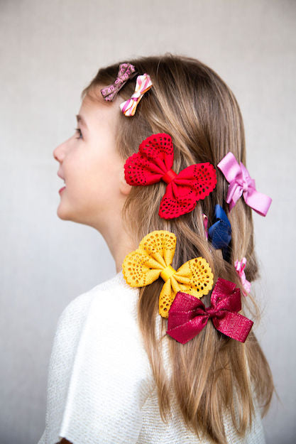 Discover our Medium Bow sparkly bow for girls in Red. Perfect hair accessory for Christmas!