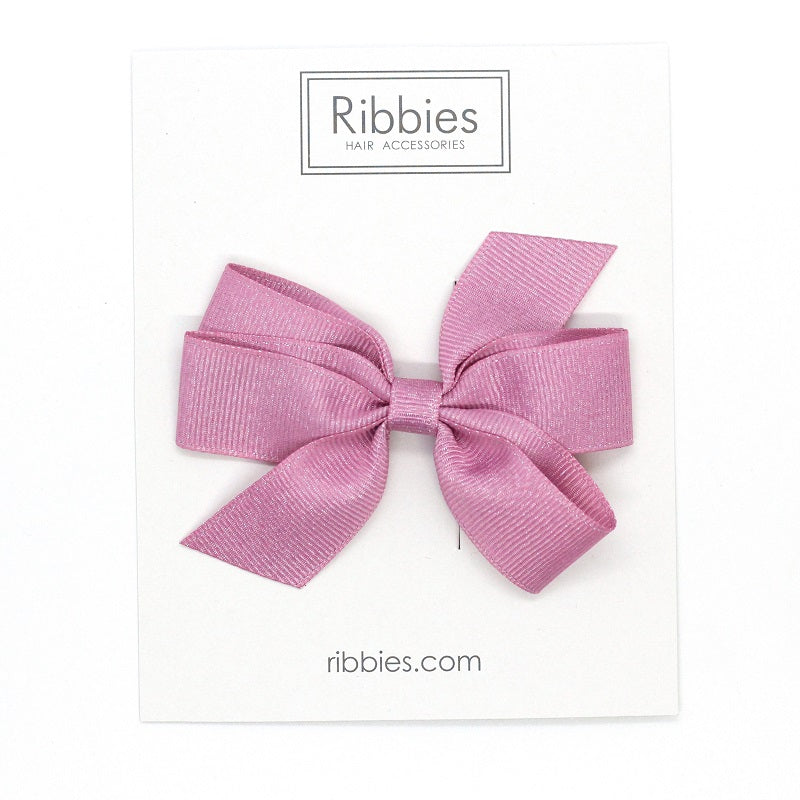 Discover our Medium Bow sparkly bow for girls in Pink. Perfect hair accessory for Christmas!